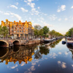 Traditional Dutch houses reflecting in the canal in Jordaan neighbourhood, Amsterdam, Netherlands