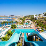 aquapark with slides and swimming pool on the seashore