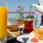 front-view-breakfast-table-people-around-table-having-their-meal-during-daytime-food-meal-breakfast