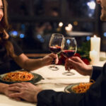 Happy couple having romantic dinner in restaurant. Happy Valentine day concept