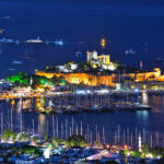 View of Bodrum harbor and Castle of St. Peter by night. Turkish Riviera.