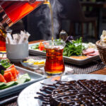 side-view-pouring-black-tea-into-armudu-glass (1)