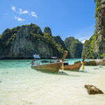 View of thai traditional longtail Boat over clear sea and sky in the sunny day, Phi phi Islands, Thailand